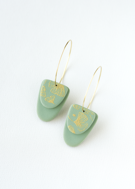 old plated stainless steel hoop earrings with green and gold accents made of polymer clay.