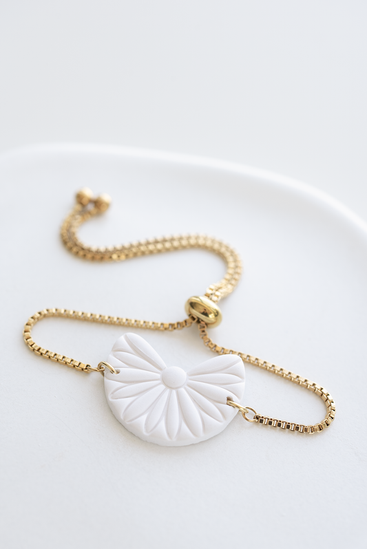 ARUBA adjustable gold plated stainless steel slider bracelet with white boho polymer clay ornament, made in Dubai