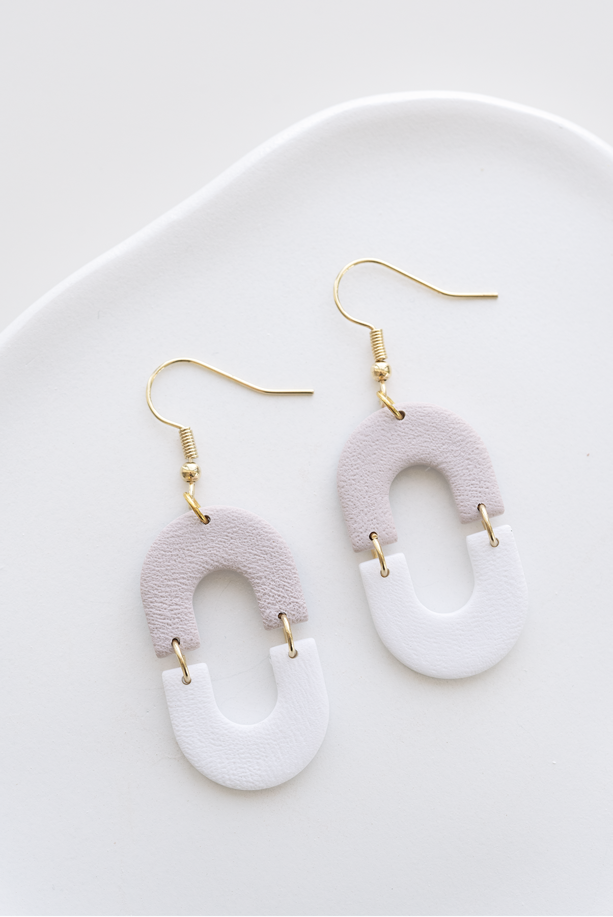 HAVAN two-tone dangle earrings, white and pale oat, stainless steel, handcrafted in Dubai, lightweight