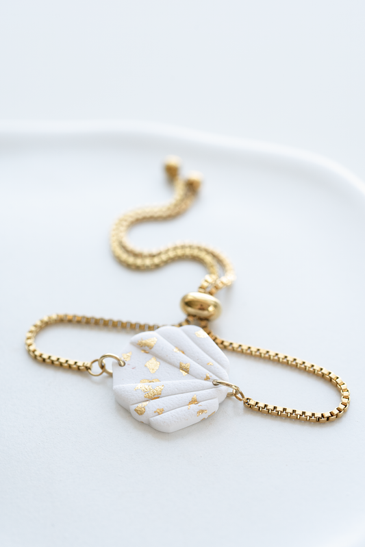 SICILY hand-crafted gold plated stainless steel slider bracelet with white and gold leaf polymer clay ornament, made in Dubai