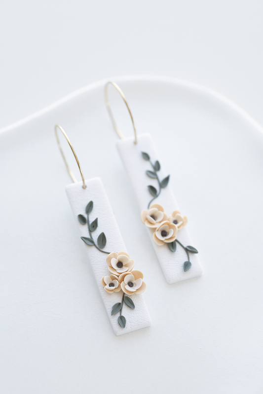 AFTER RAIN hand-sculpted earrings with floral design on white background, flower earrings, perfect for weddings and everyday wear, nature-inspired jewelry