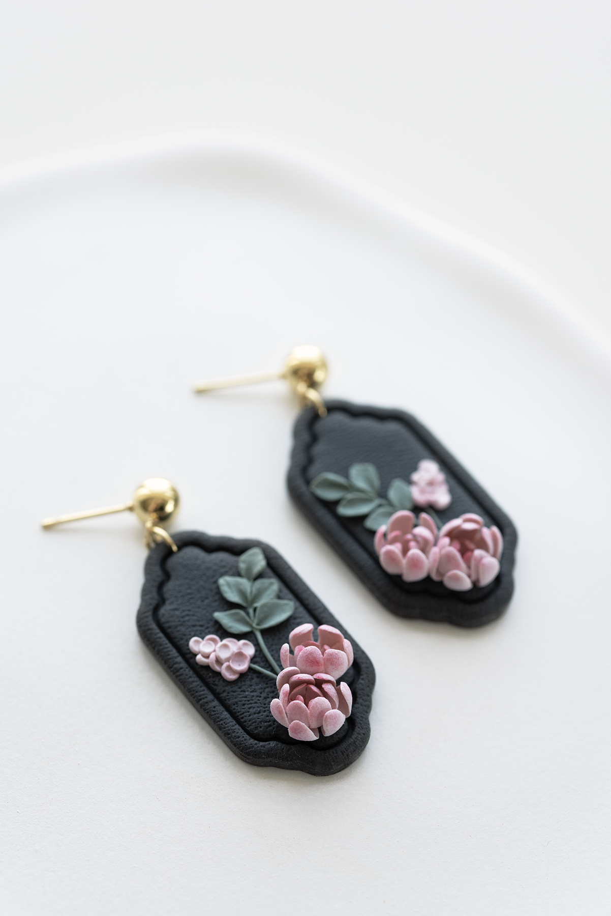 NIGHT BLOOM hand-sculpted earrings with floral design on dark background, vintage flower earrings. Inspired by nature, made in Dubai.