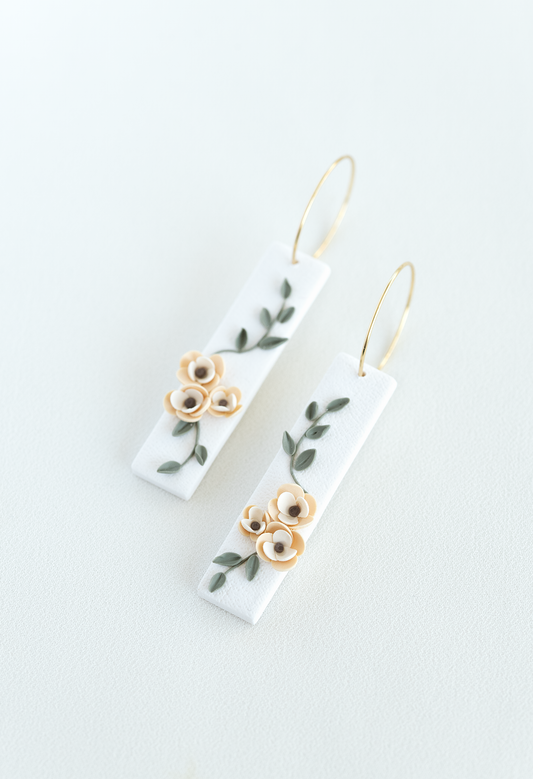 Pair of earrings with floral design on a white background, flower earrings, perfect for weddings and everyday wear.