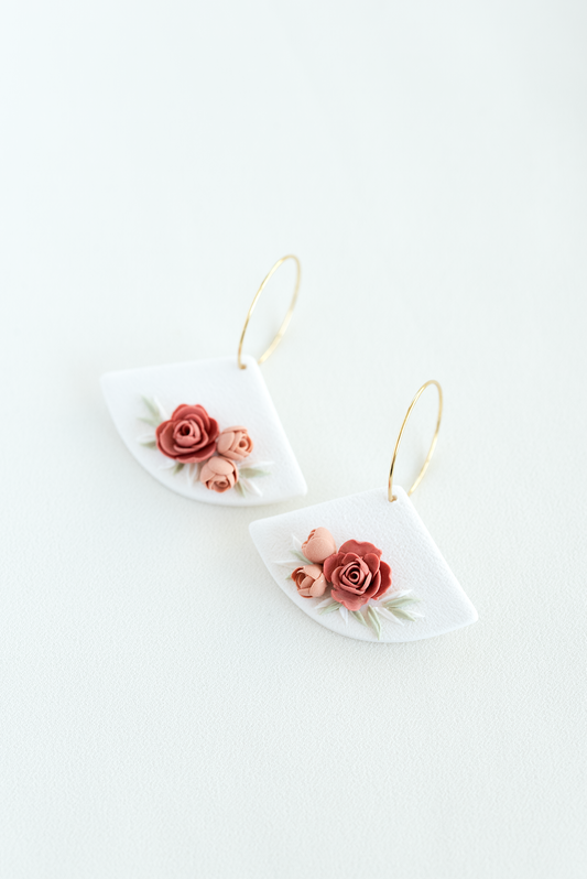 Pair of earrings with floral design on a white background, flower earrings, perfect for weddings and everyday wear.
